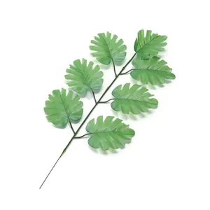 Artificial monstera green plant branch for home wedding floral arrangement decor.