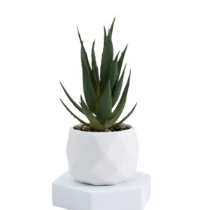 Artificial succulent plant in white geometric ceramic pot for office desktop decor.