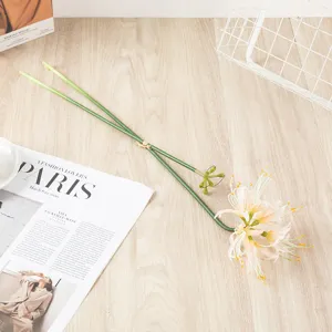 Detailed view of artificial rain lily flower stem with realistic green petals and floral head.