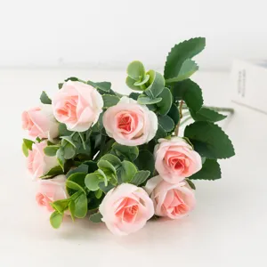 Artificial pink rose bouquet detail, realistic fake flower arrangement for home decor.