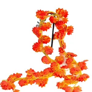Artificial maple leaf vine for outdoor and park decoration, vibrant autumn foliage garland.