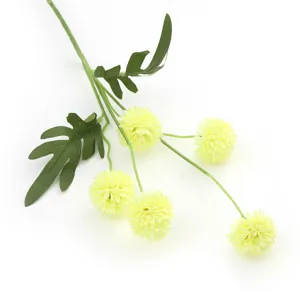 Artificial yellow pompon chrysanthemum flower stem detail closeup for home wedding decor