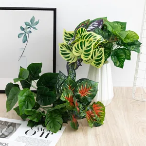 Artificial monstera leaves potted plant fake green foliage for home office indoor room decor.