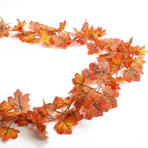 Artificial autumn maple leaf garland for seasonal home decoration and autumn holiday hanging vine decor.
