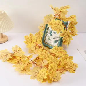 Artificial maple leaf vine detail shot, perfect autumn decoration plant garland hanging.