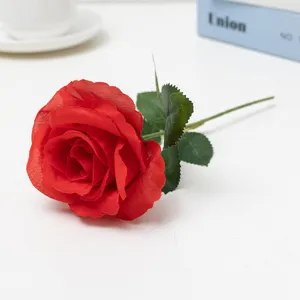 Artificial red rose flower detail, single stem faux floral decoration for wedding home decor.