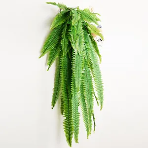 Detail close-up of artificial Boston fern wall hanging, lush green fronds for indoor decor display.