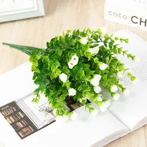 Artificial eucalyptus flower bouquet with white rose buds, detailed indoor plant decor.