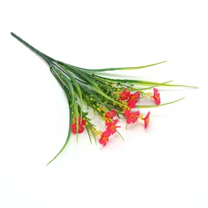 Artificial spring grass with small flowers for home decor and floral arrangements.