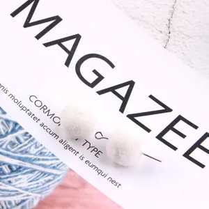 DIY jewelry accessories white fluffy pom-pom earrings detail showing metal 9-pin components