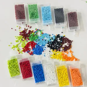 Colorful 2mm glass seed beads set in clear storage boxes, ideal for DIY jewelry crafting.
