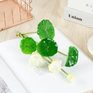 Artificial lotus flowers and small lily pads for table and plate decoration, lifelike green plants.