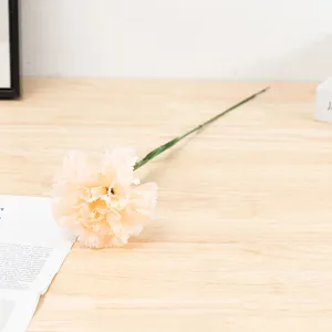 Artificial single carnation silk flower detail shot for home decor and Mother's Day gift.