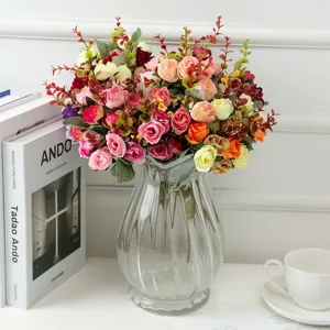 Artificial silk rose bouquet with clear glass vase for home wedding party decoration.