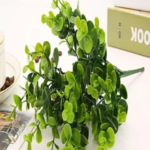 Artificial eucalyptus plant detail showing green leaves arrangement for home floral decor.