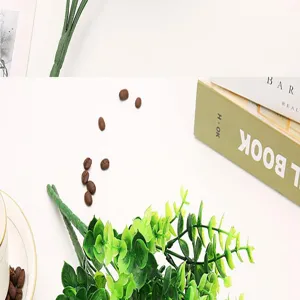 Artificial eucalyptus plant detail view, plastic simulation green leaves for home decor.