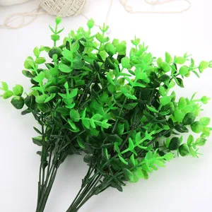 Artificial eucalyptus leaf stem detail, realistic plastic green plant for DIY floral decor.