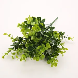 Artificial eucalyptus plant detail, plastic greenery bunch for home decor and floral arrangements.