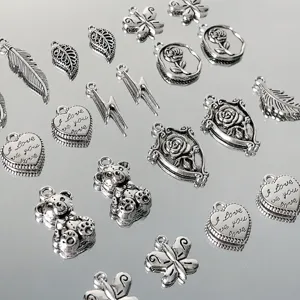 Alloy DIY charms set with cute heart, butterfly, bear, and rose pendants for handmade jewelry.