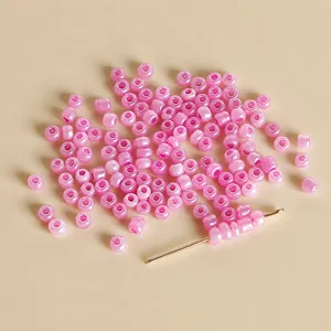 Detailed view of 3mm jelly pink seed beads for DIY handmade bracelets, necklaces and jewelry.