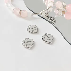 Alloy heart charm pendant for DIY handmade bracelet necklace jewelry making materials detail view.