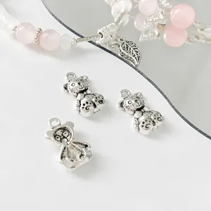 Detailed shot of silver alloy bear charms for DIY handmade jewelry bracelets and necklaces.