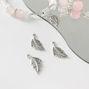 Silver feather charm detail shot, alloy material, ideal for DIY handmade necklaces and bracelets.