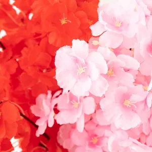 Close-up macro view of artificial cherry blossom flower branch for home decoration.