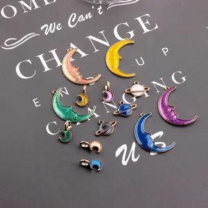 Alloy DIY jewelry charms, glitter moon and planet pendants, craft accessories detail.