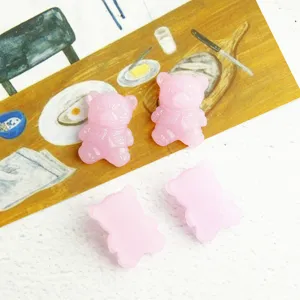 Pink resin bear flatback charms close-up, translucent jelly style for DIY phone case crafts.