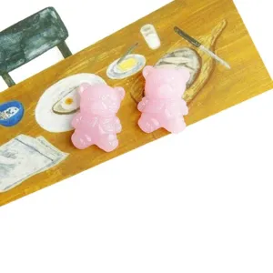 Translucent jelly pink bear resin flatback charms for DIY phone case jewelry design.