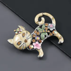Detailed view of the vintage enamel cat brooch with sparkling rhinestones and floral accents.