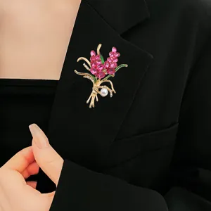 Elegant bouquet brooch with pink crystals and pearl accent, stylish alloy lapel pin accessory.