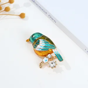 Vintage enamel bird brooch with sparkling rhinestones and colorful details for elegant daily wear.