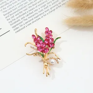 Elegant crystal floral brooch detailed with pink rhinestones and pearl for women detail view