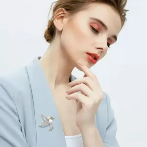 Exquisite enamel peace dove brooch with sparkling rhinestones for elegant daily wear.