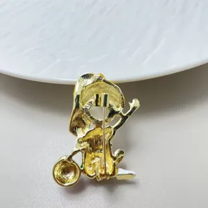 Detailed view of the cute cartoon ballet girl brooch back pin mechanism, gold plated.