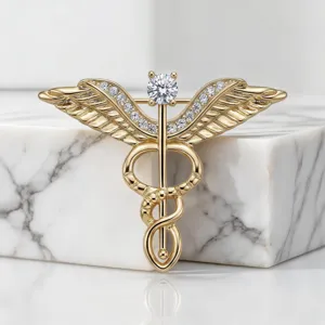Broche caduceo dorada con diamantes estrás, alfiler vintage de alas para trajes y abrigos.