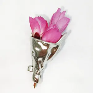 Metal bouquet brooch detail shot, creative cone design for inserting flowers, exquisite fashion.