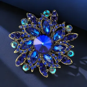 Exquisite vintage blue crystal rhinestone flower brooch, elegant lapel pin accessory.