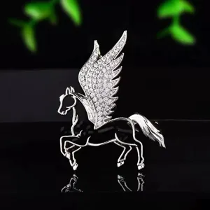 Close-up detail of the exquisite winged horse brooch with sparkling cubic zirconia paved wings.