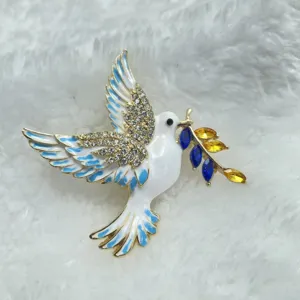 Elegant peace dove brooch with white enamel, sparkling rhinestones, and colorful crystal olive branch.