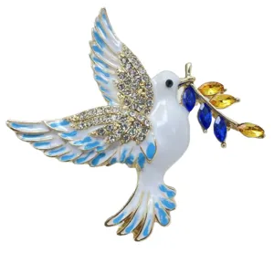 Elegant white and blue enamel peace dove brooch with sparkling rhinestones and crystal branch.