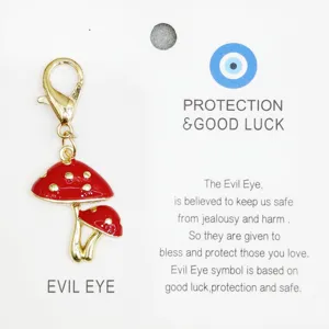 Pendentif en alliage champignon rouge avec fermoir mousqueton et carte mauvais oeil.