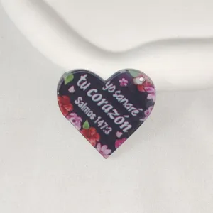 Heart shaped acrylic charm detail, floral printed pendant DIY keyring accessory close up.