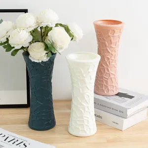 Modern decorative plastic vase with artificial peony flowers set for home tabletop decor.