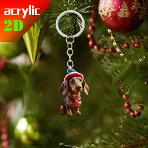 Detailed view of the cute dachshund Christmas acrylic keychain hanging on a festive tree.