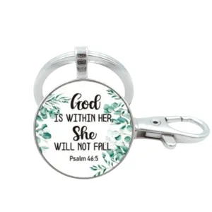 Inspirerende quote metalen sleutelhanger met glazen cabochon en eucalyptus blad ontwerp.