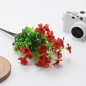 Artificial eucalyptus flower bouquet with red flowers for home decor and party styling.