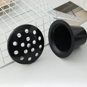 Detail shot of black plastic floor drain core and strainer cover for sewer anti-odor.